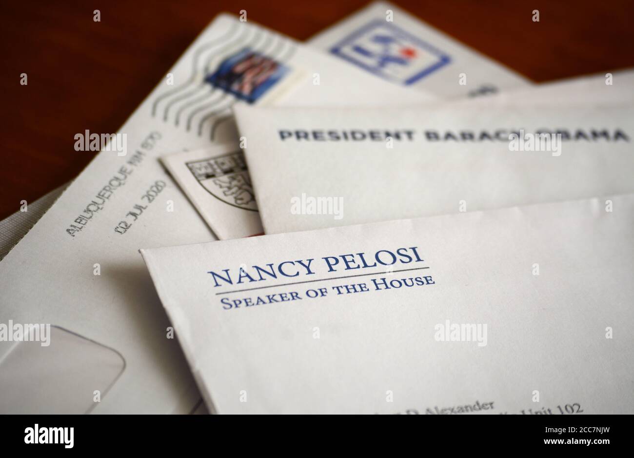 Political mail or campaign mail sent to a Democratic Party donor by House Speaker Nancy Pelosi and former President Barack Obama. Stock Photo