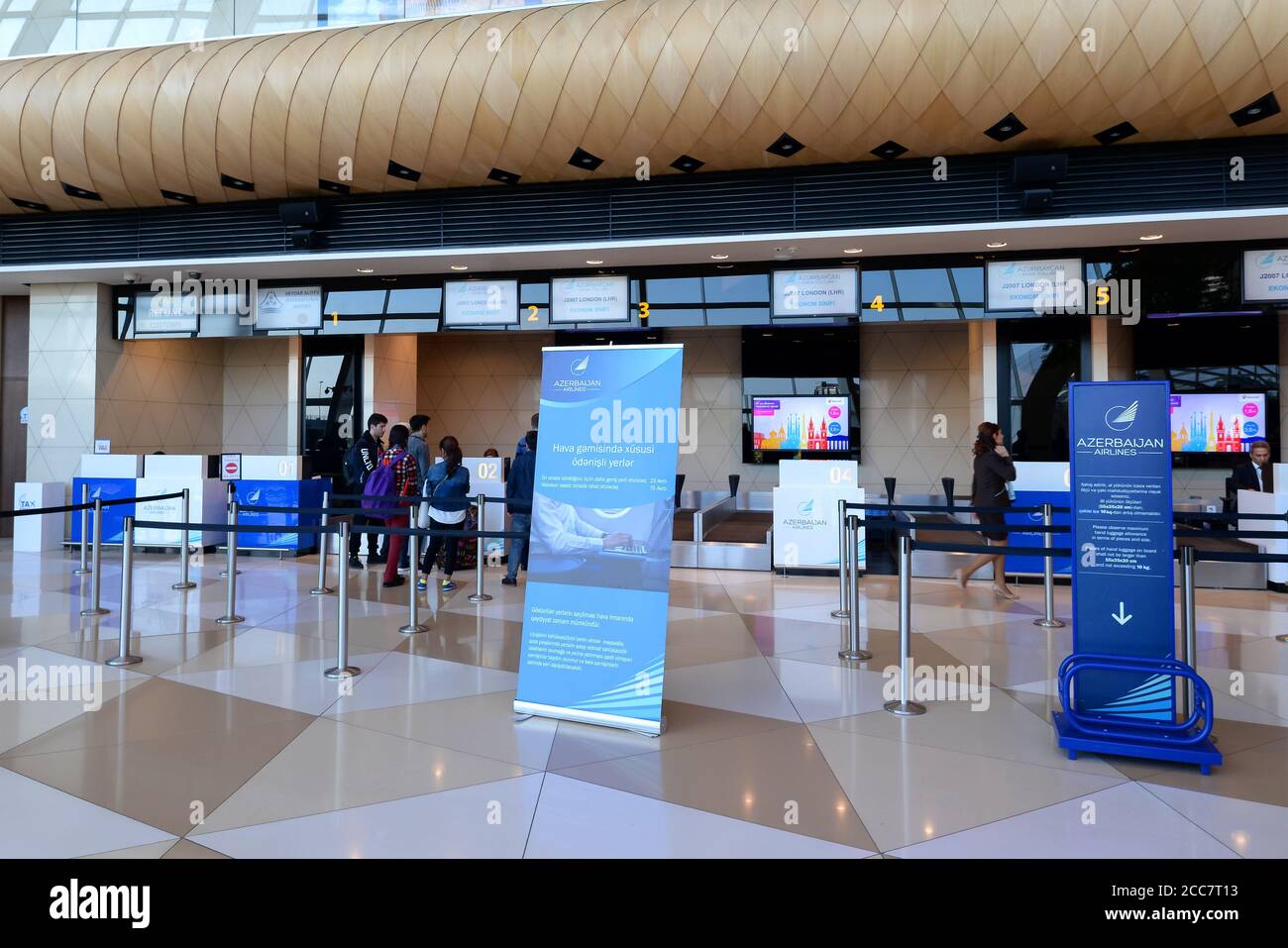 Check-in area of Azerbaijan Airlines flight to London in Baku Airport. Interior view of Heydar Aliyev International Airport in Azerbaijan. Stock Photo