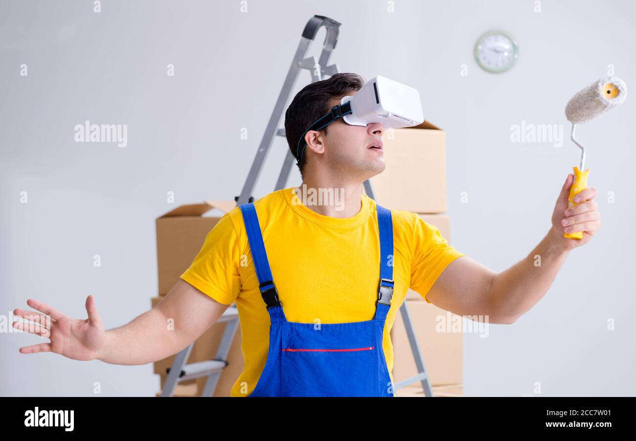 The painter contractor working with virtual reality goggles Stock Photo