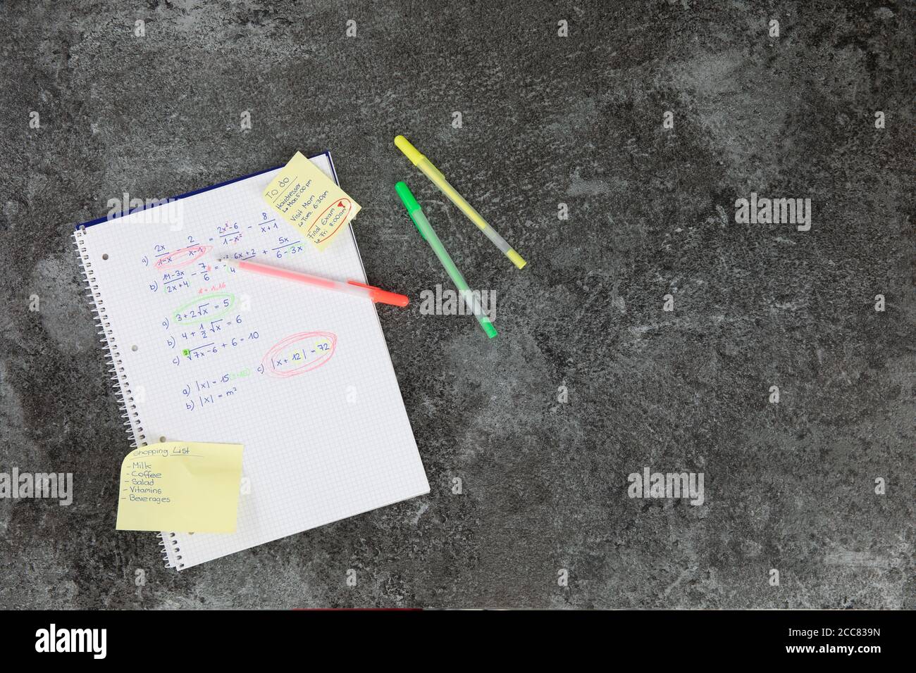 mathematics book with calculation tasks, with orange, yellow and green