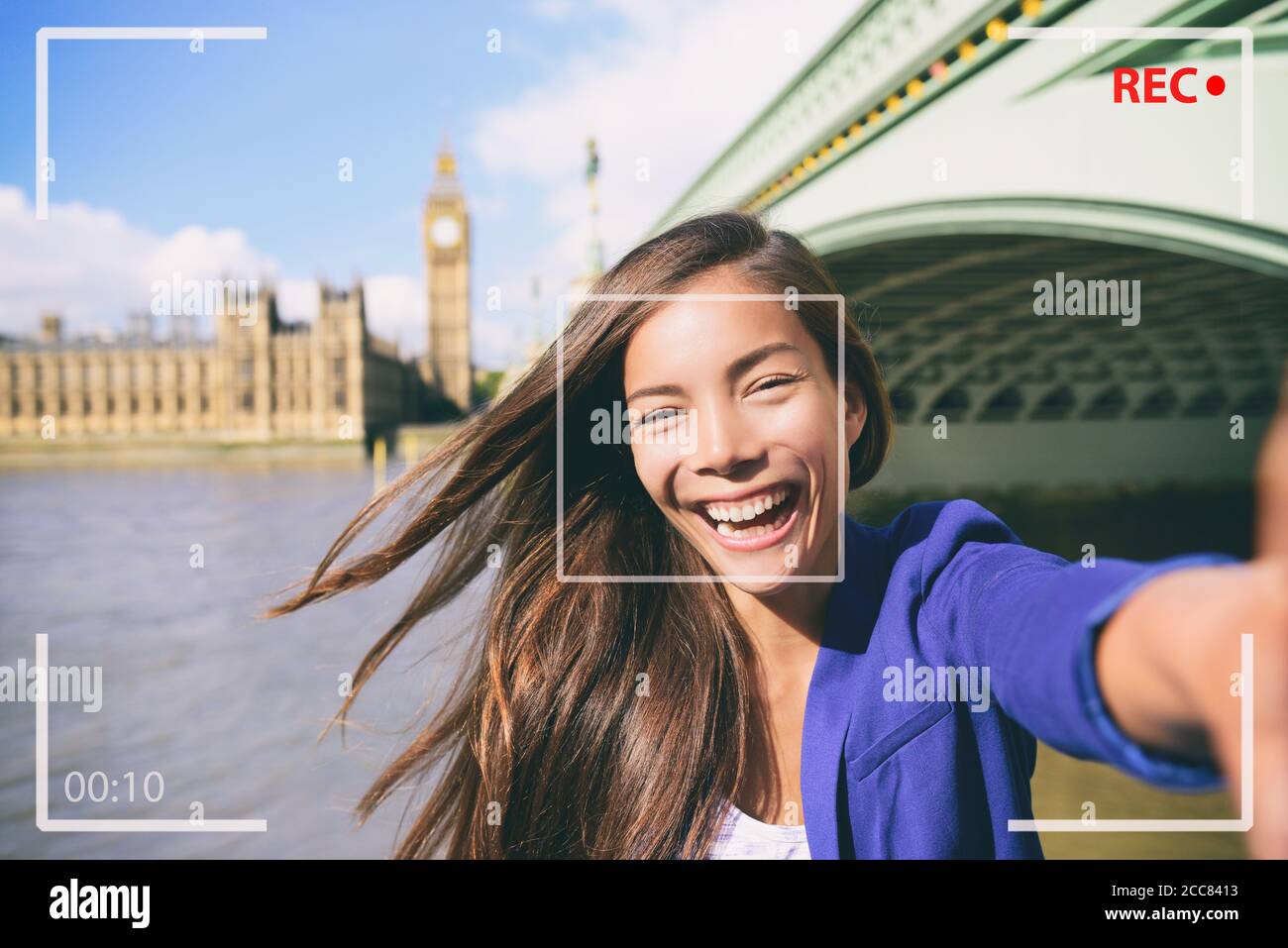 Selfie portrait travel woman recording video vlog on mobile phone. Camera screen of Asian tourist girl on London Europe vacation vlogging talking on Stock Photo