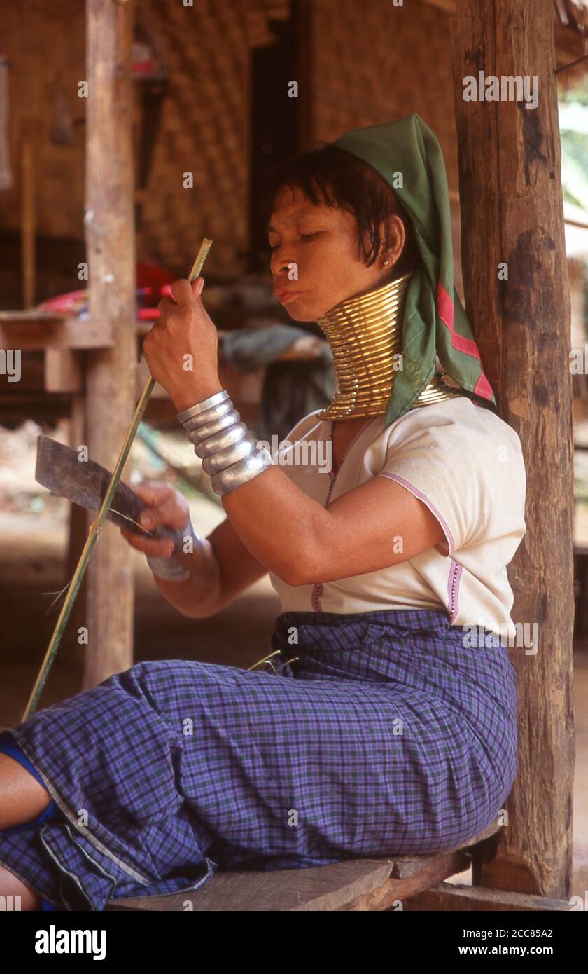 Thailand: Padaung (Long Neck Karen) woman in a village near Mae Hong Son, northern Thailand. The Padaung or Kayan Lahwi or Long Necked Karen are a subgroup of the Kayan, a mix of Lawi, Kayan and several other tribes. Kayan are a subgroup of the Red Karen (Karenni) people, a Tibeto-Burman ethnic minority of Burma (Myanmar). Stock Photo