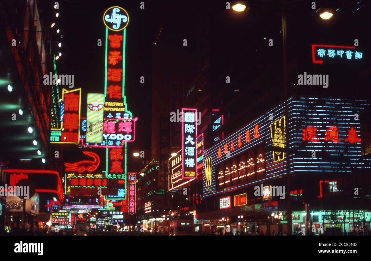 China: Neon signs on Nathan Road, Kowloon, Hong Kong (1987).  Originally a sparsely populated area of farming and fishing villages, Hong Kong has become one of the world's most significant financial centres and commercial ports. It is the world's tenth-largest exporter and ninth-largest importer.  Hong Kong became a colony of the British Empire after the Qing Empire ceded Hong Kong Island at the end of the First Opium War in 1842. Stock Photo