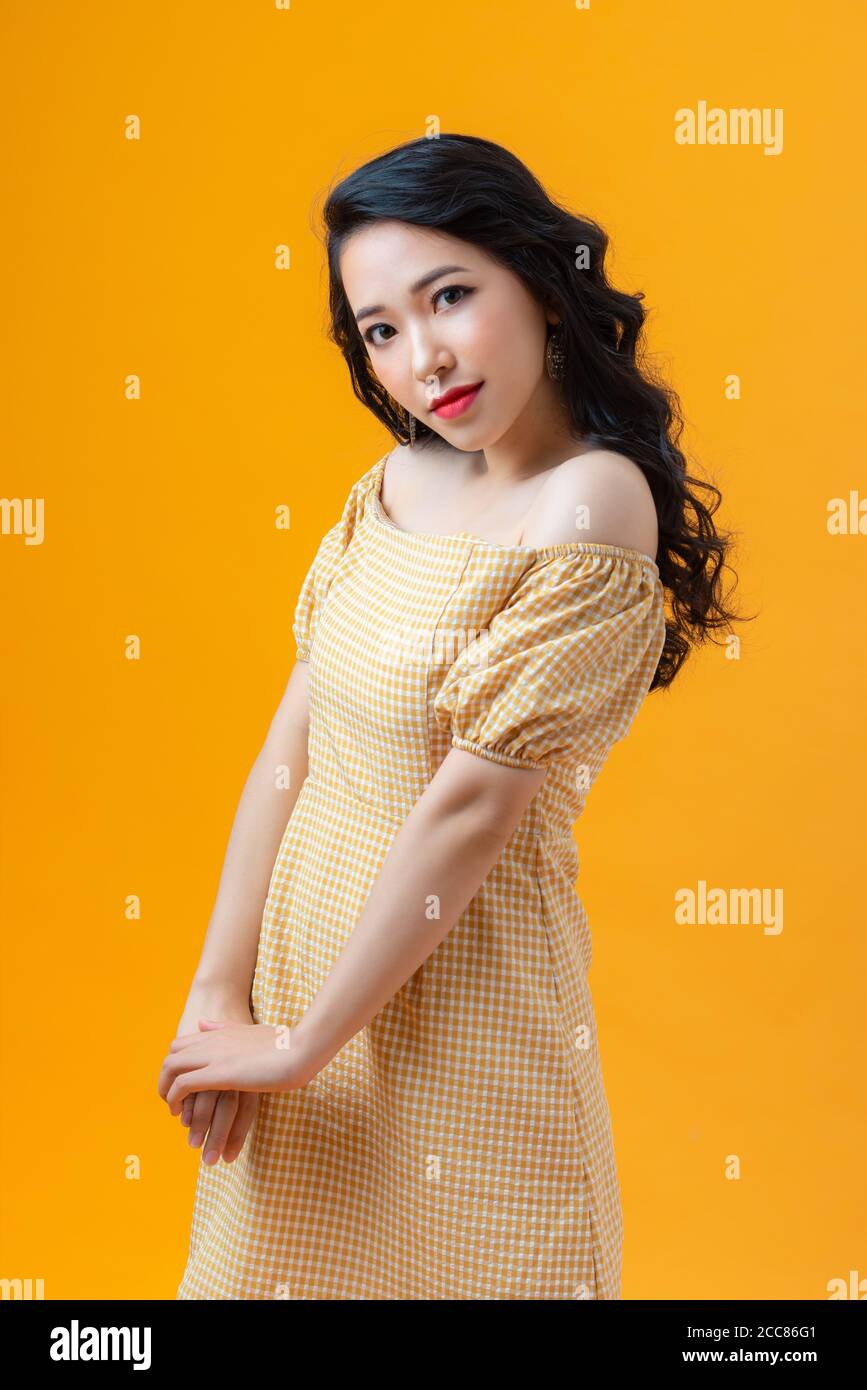 Closeup photo of funny lady good mood sly wear casual  isolated yellow color background Stock Photo