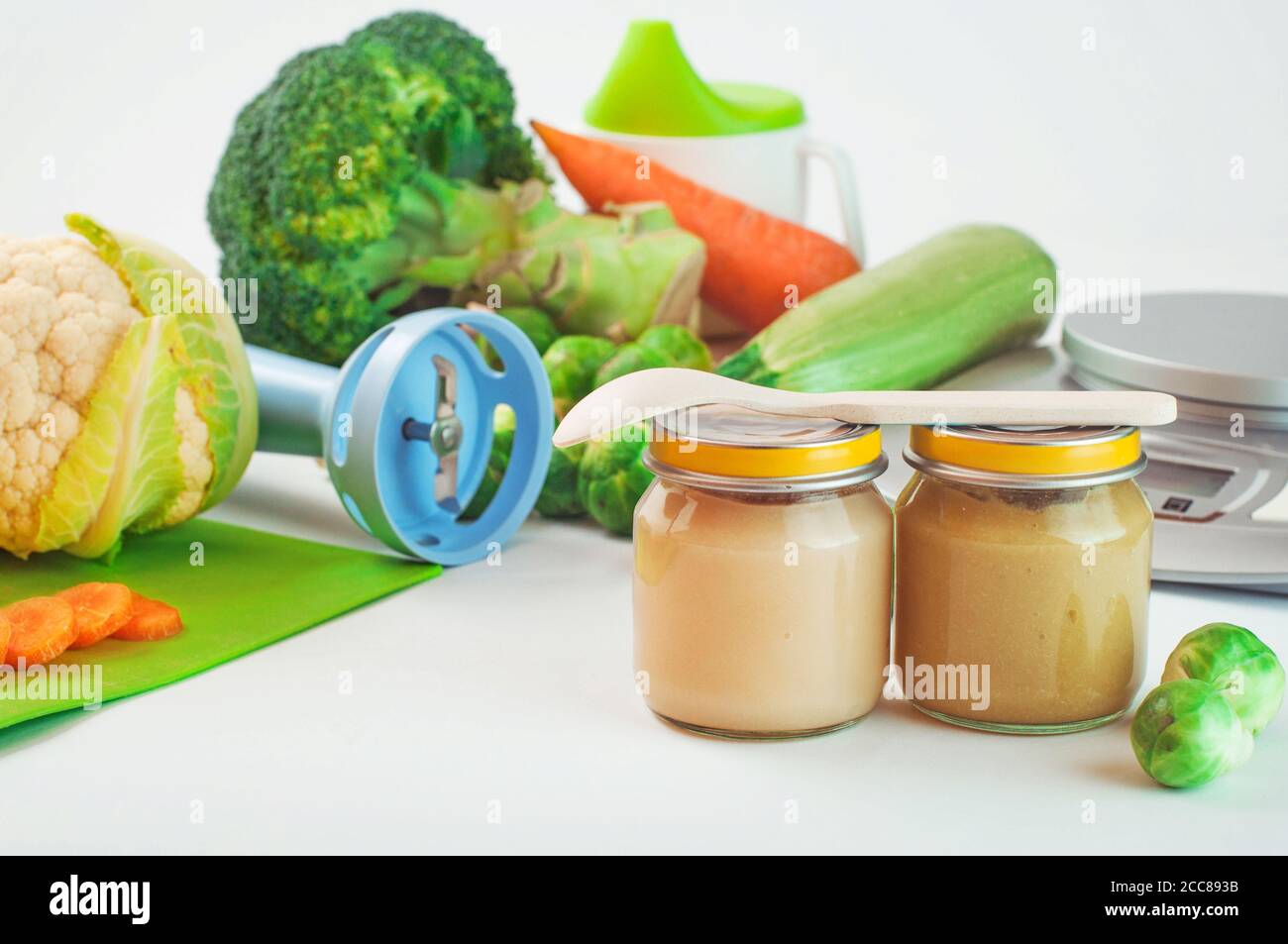 Glass jars with natural baby food on the table Stock Photo