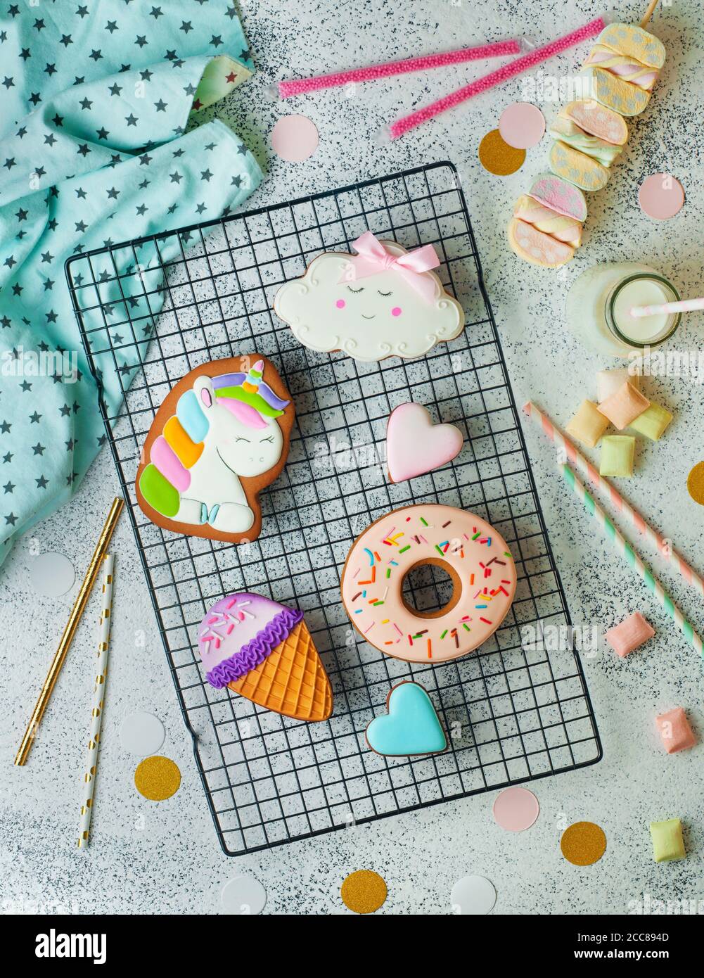 Funny ice cream cone, donut and cloud cookies gingerbread on lattice on party background Stock Photo