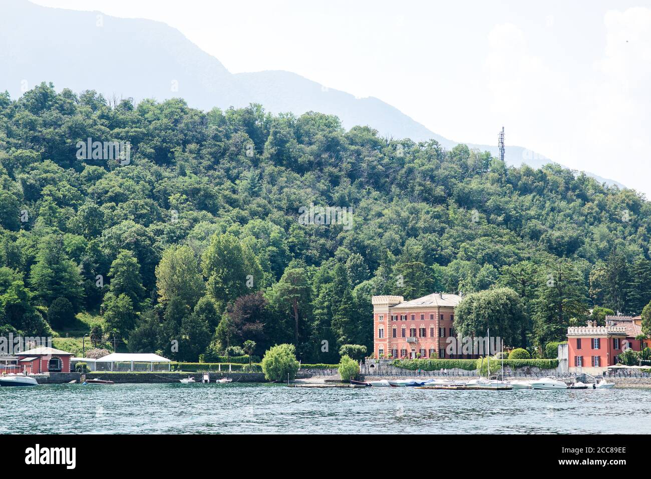 Shoreline of Lenno Сommune on Como Lake. Lombardy. Italy. Panorama with Mountains and Forest. Stock Photo