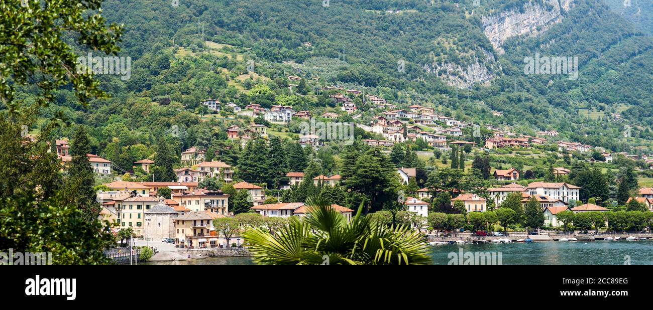 Lenno Town on Como Lake. Lombardy. Italy. Picturesque Italian Landscape. Stunning Panorama with Mountains and Forest. Stock Photo