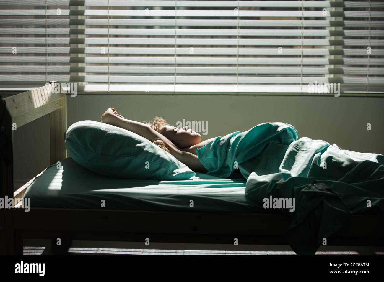 Kids sleeping in bed. Child in bed after waking up, entering a day happy and relaxed after good night sleep. Sweet dreams, good morning, new day Stock Photo