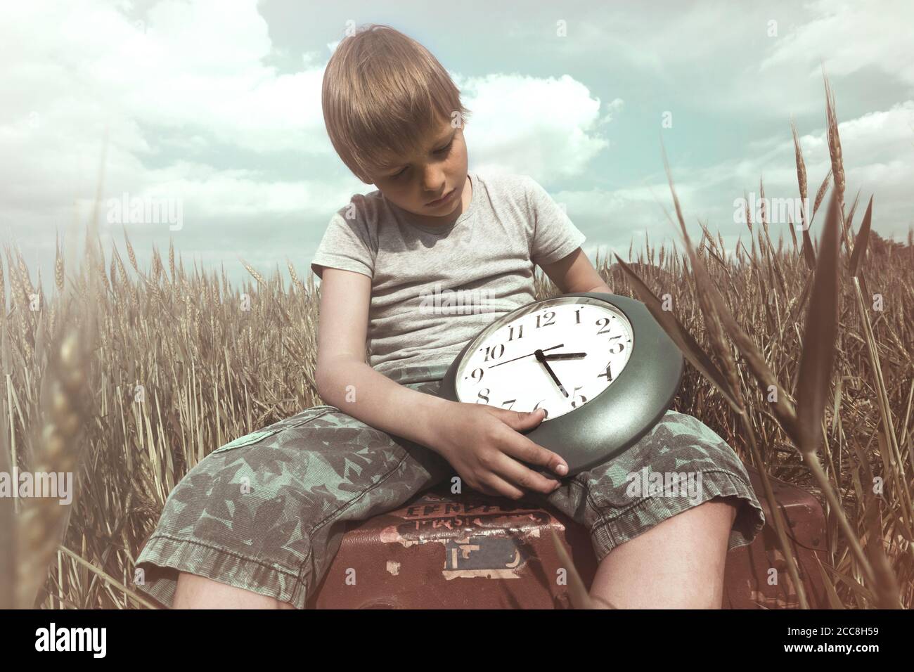 Young boy has the power to control the time Stock Photo