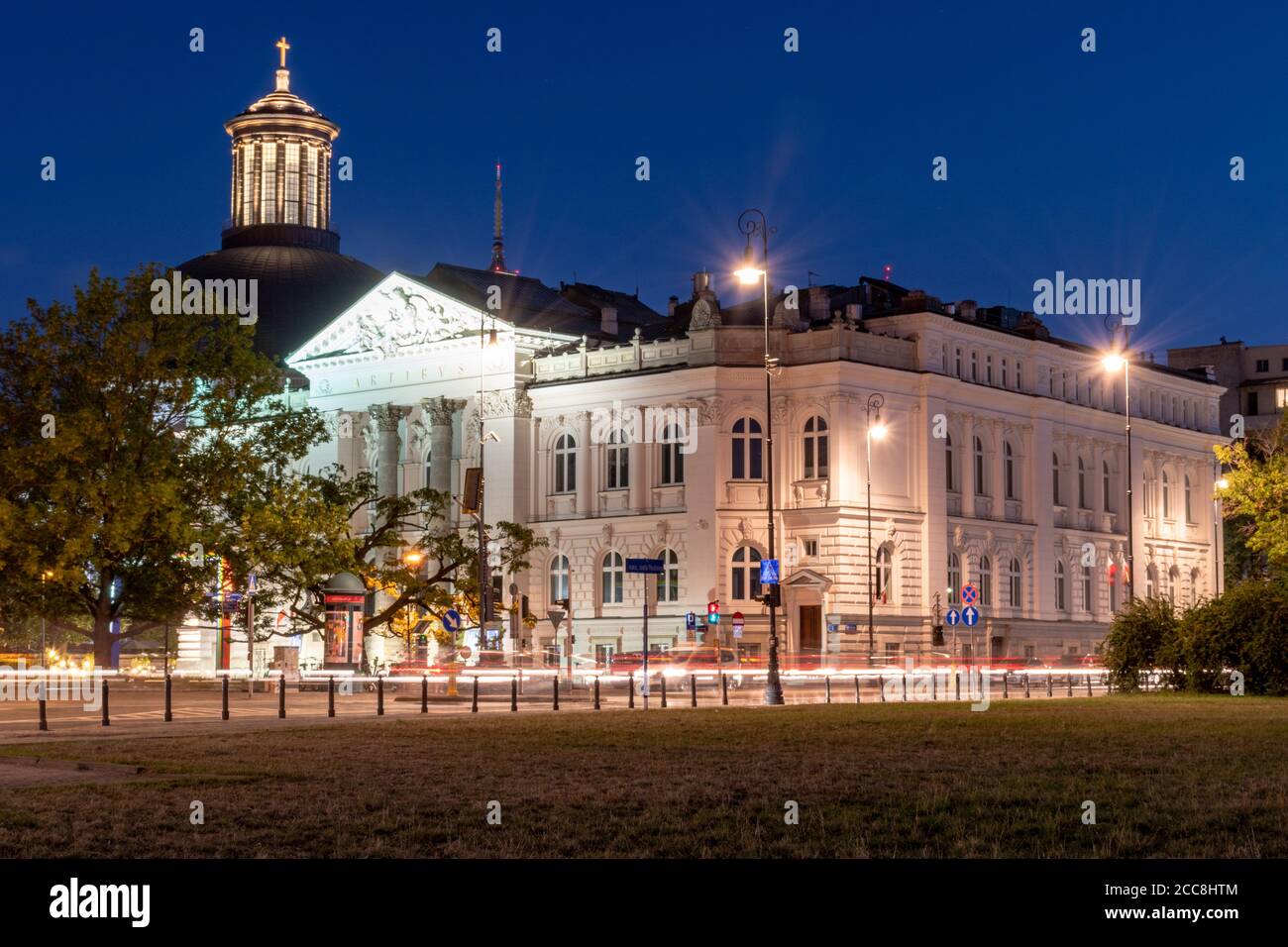 Warsaw, Poland - August 15, 2020: Zacheta Art Gallery building with Holy Trinity Evangelical Church of the Augsburg Confession. Stock Photo