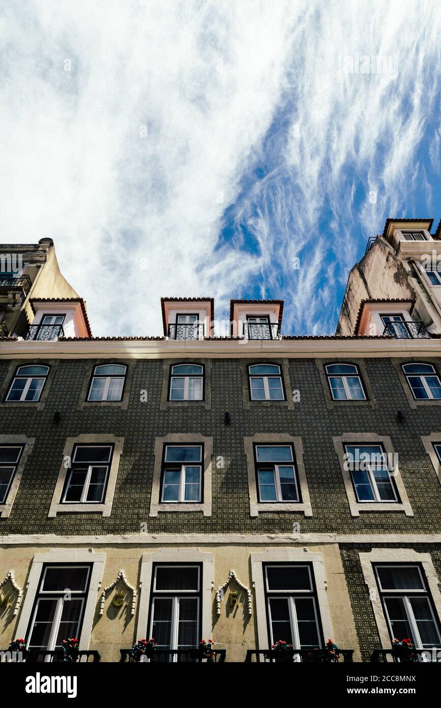 Low angle shot of the facade of a classic building with many windows ...