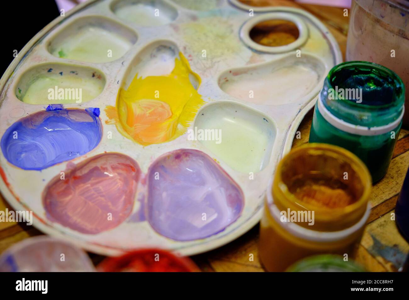 artist palette and multi colored gouache close up. Stock Photo