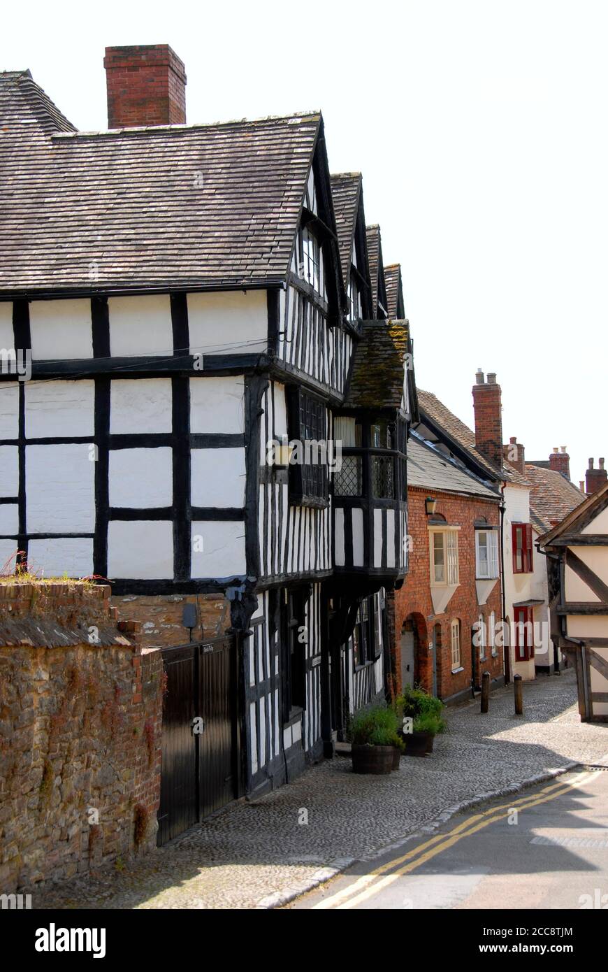 Church Lane, Ledbury, Herefordshire, England, with Church House, the half-timbered building, on the left hand side Stock Photo