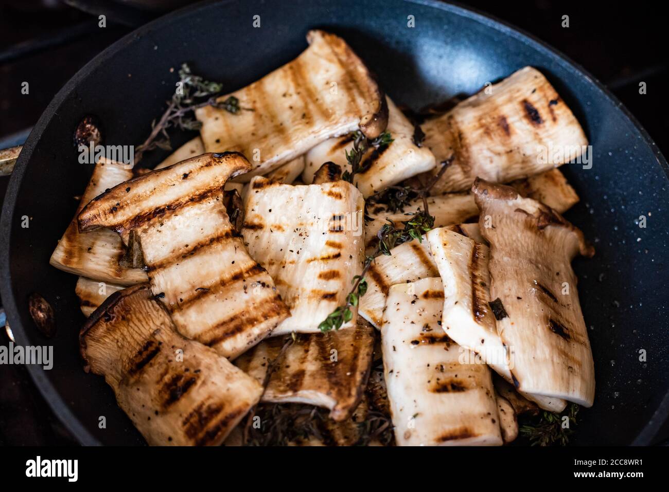 Grilled King oyster trumpet mushrooms Stock Photo