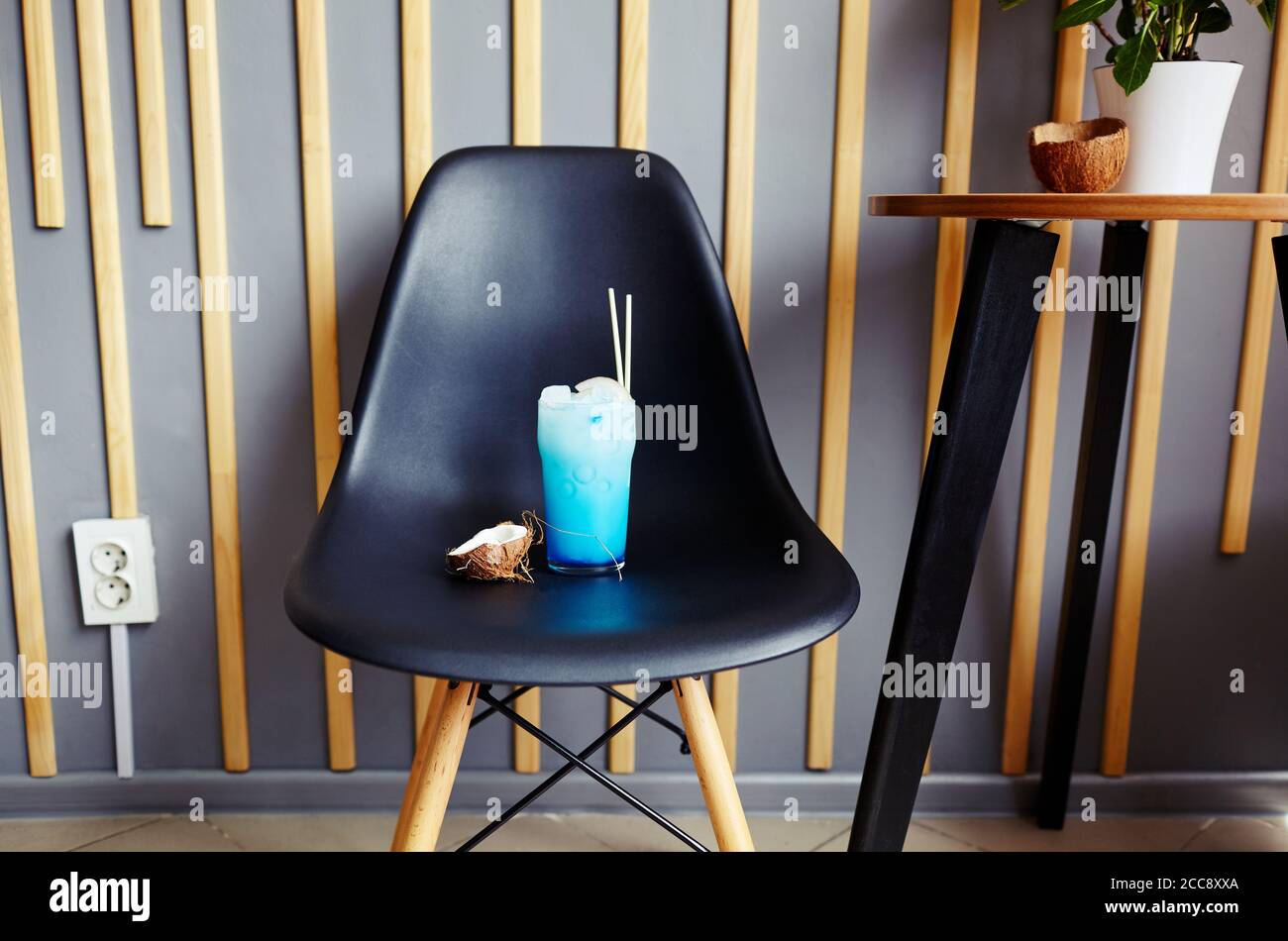Blue hawaii cocktail and coconut in bar Stock Photo