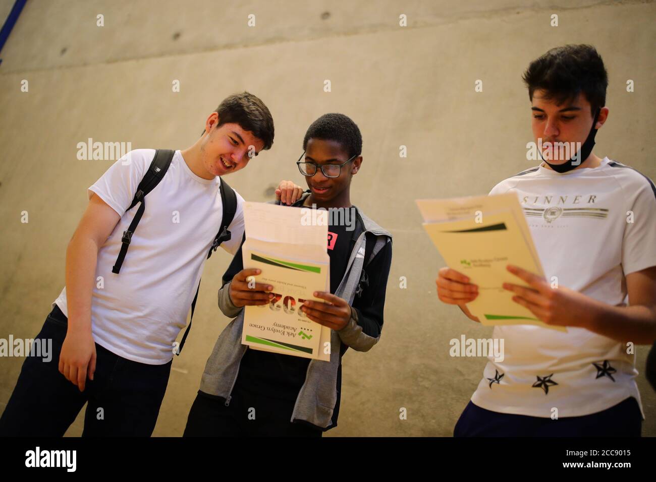 Students discuss their GCSE results at Ark Evelyn Grace Academy, London. Stock Photo