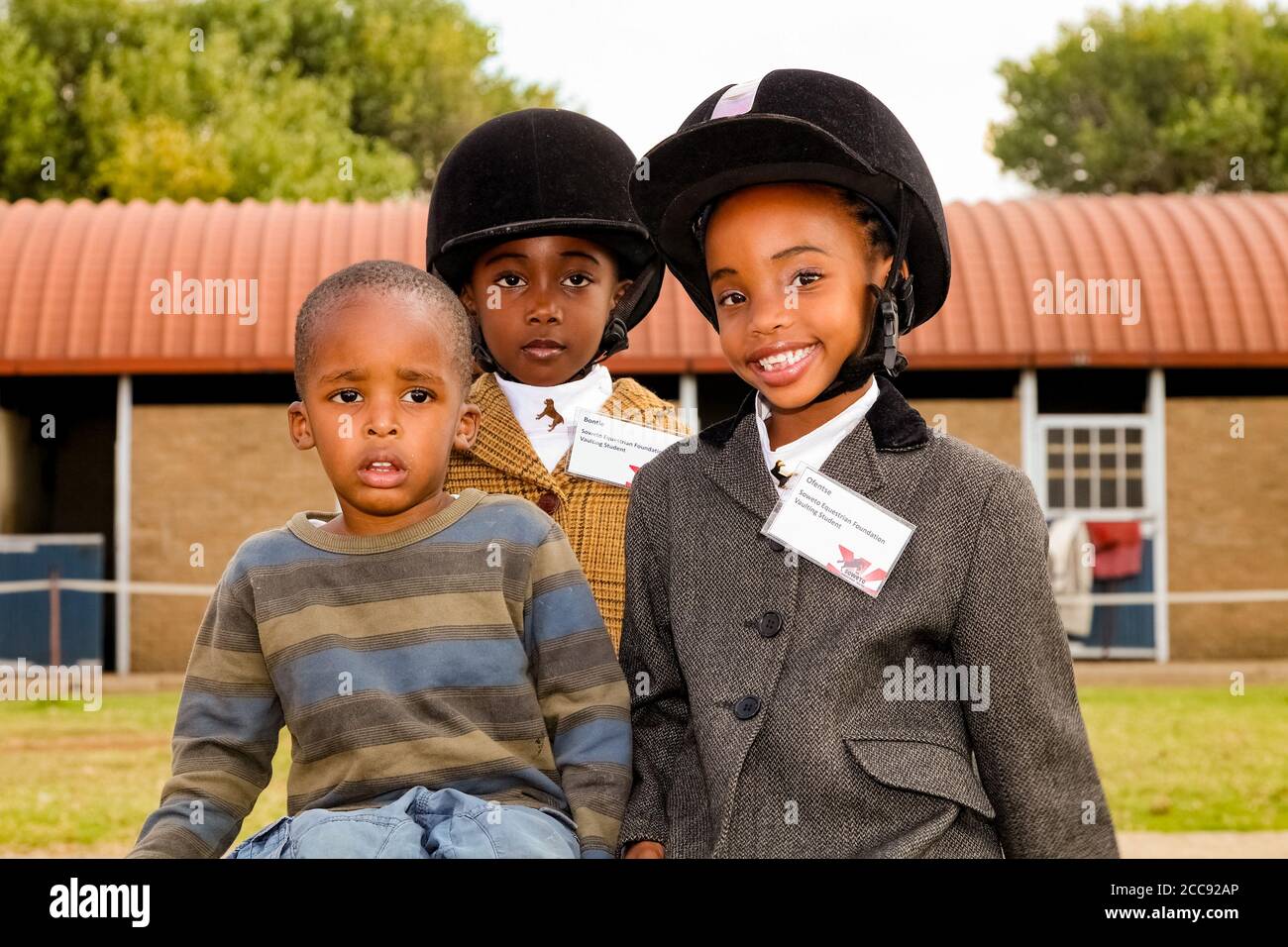 Soweto, South Africa April 16, 2012 Young African horse riding kids
