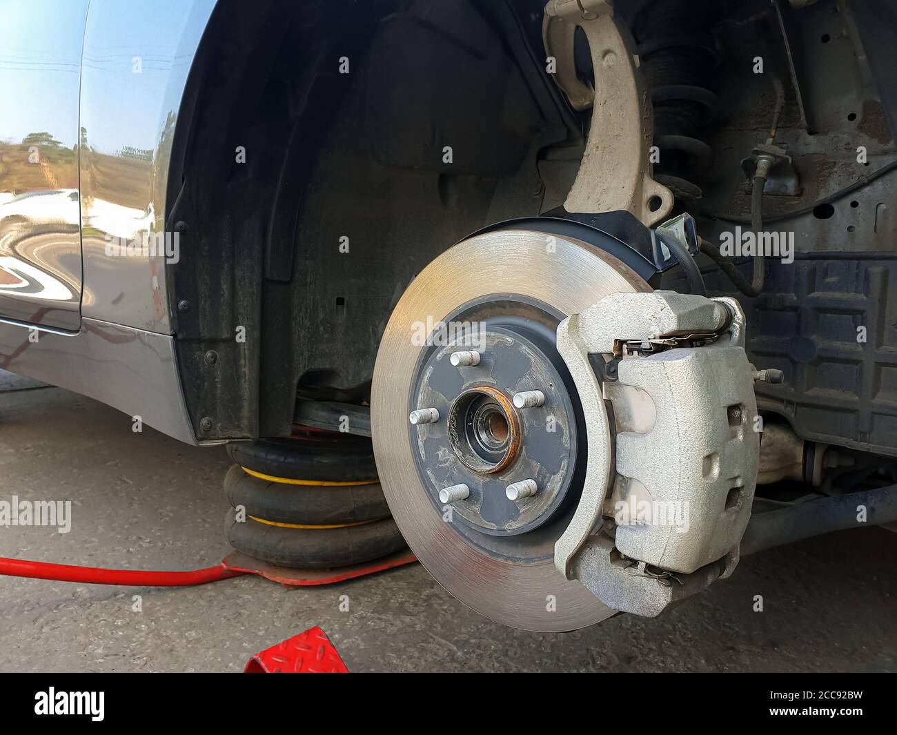 Tire. Closeup of the car's brake drive, replacement of auto parts