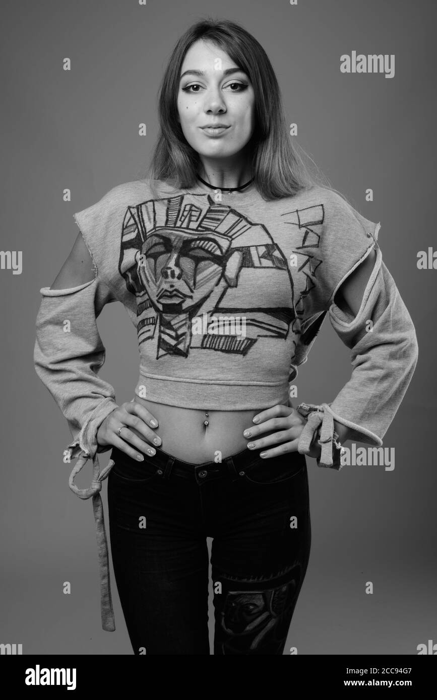 Young Beautiful Rebellious Woman Against Gray Background Stock Photo Alamy