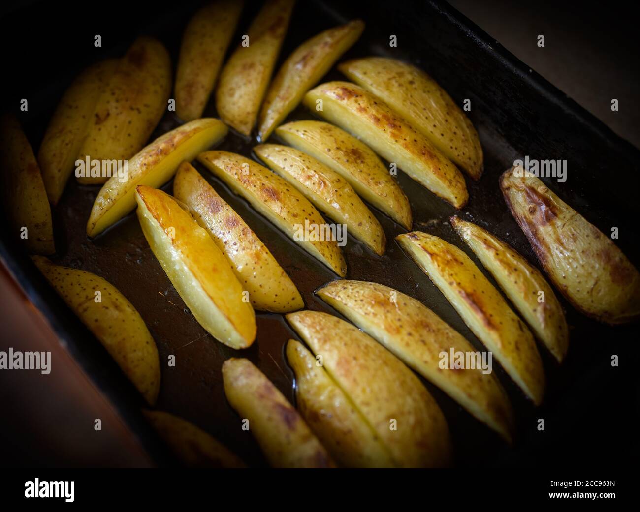 Home made rustic fried potatoes on baking sheet Stock Photo Alamy