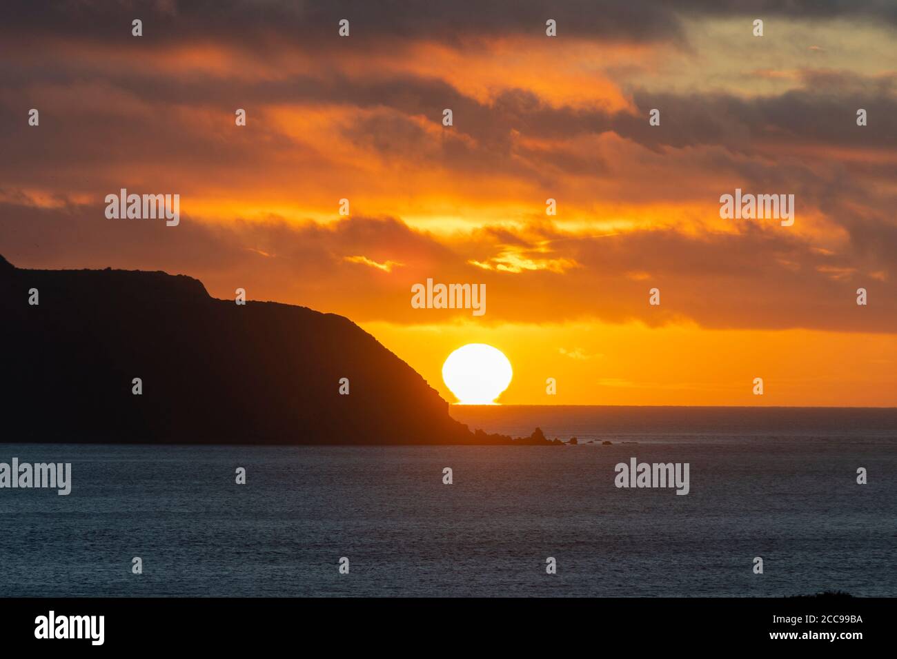 Sunset beside Mana Island, Cook Strait, Titahi Bay, Porirua, Wellington, North Island, New Zealand Stock Photo