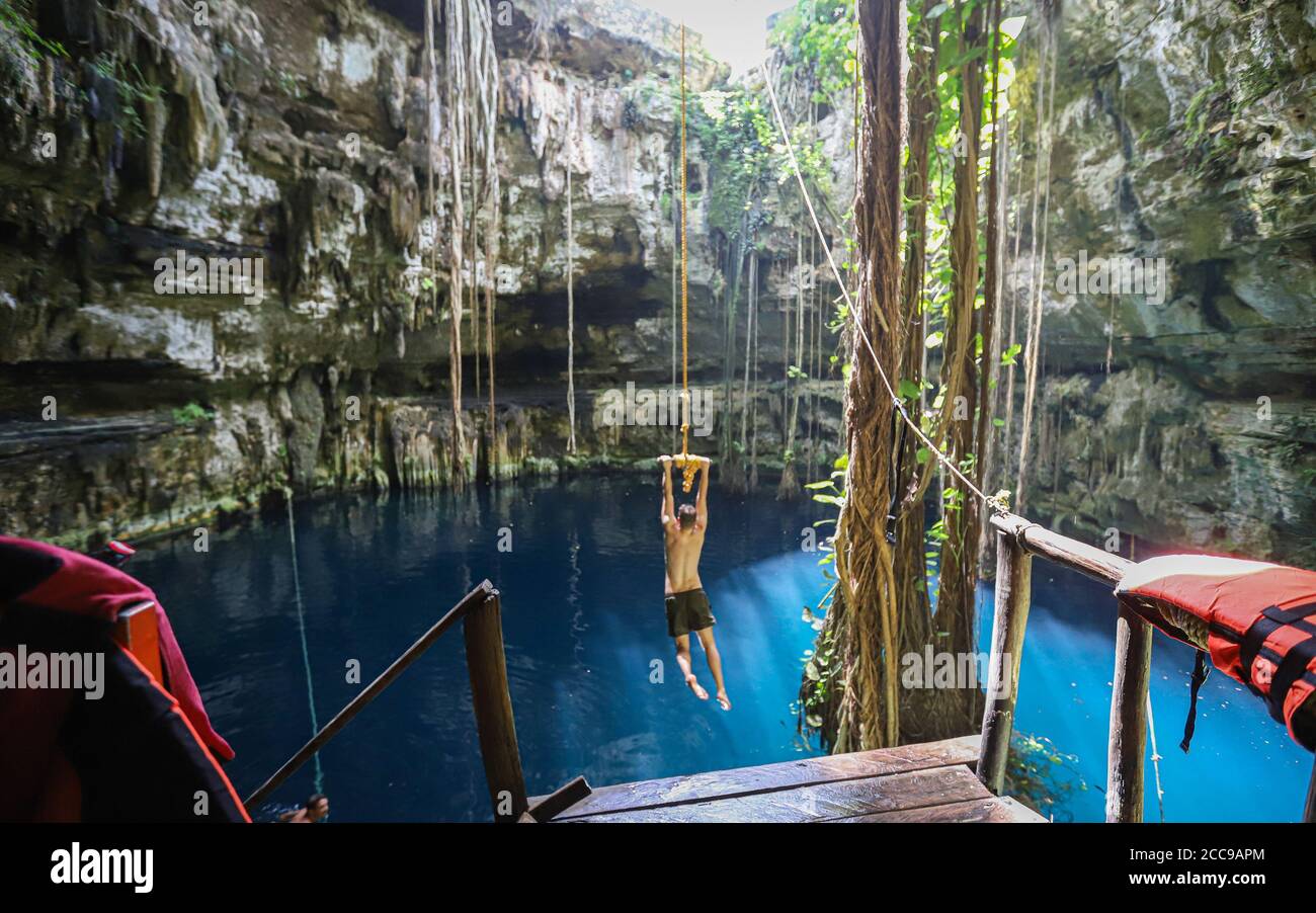 Rope swing at Cenote San Lorenzo Oxman Stock Photo Alamy