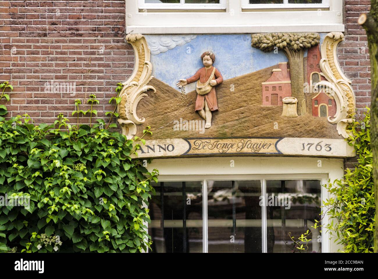 old guild sign on an brick facade in Amsterdam, Netherland  Langue des mots-clés : English Stock Photo