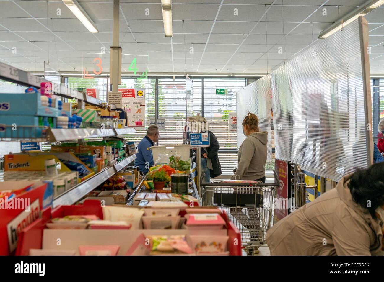 BERLIN, GERMANY - May 14, 2020: BERLIN, GERMANY May 14, 2020. Supermarket in Berlin under a protective screen because of Covid-19. Stock Photo