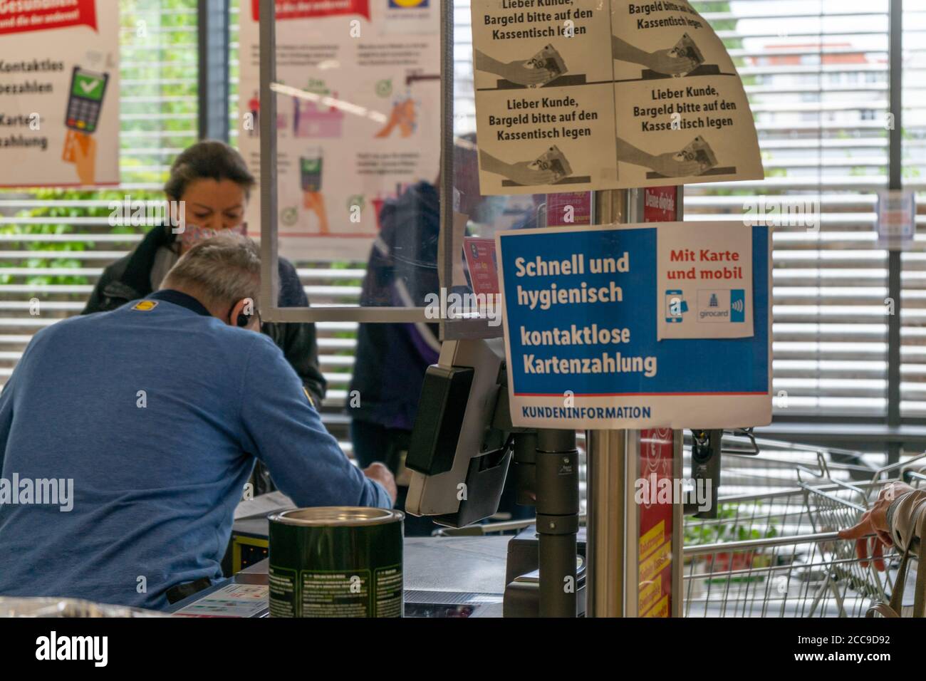BERLIN, GERMANY - May 14, 2020: BERLIN, GERMANY May 14, 2020. Supermarket in Berlin under a protective screen because of Covid-19. Stock Photo