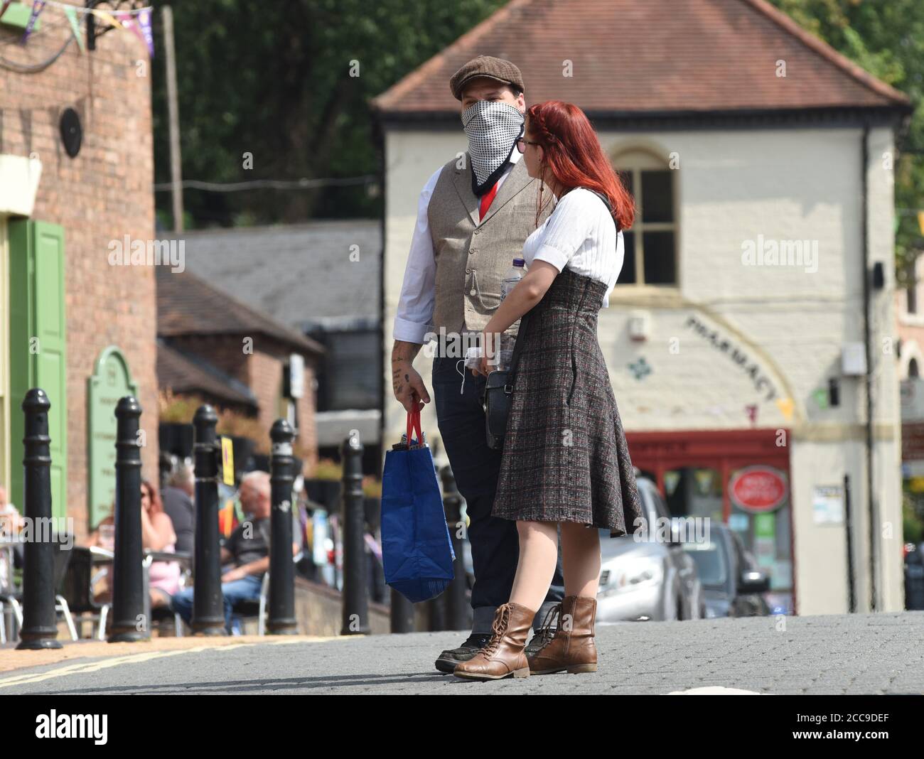 Ironbridge, Shropshire. Couple wearing face masks during Covid-19 pandemic Britain Uk 2020 Stock Photo