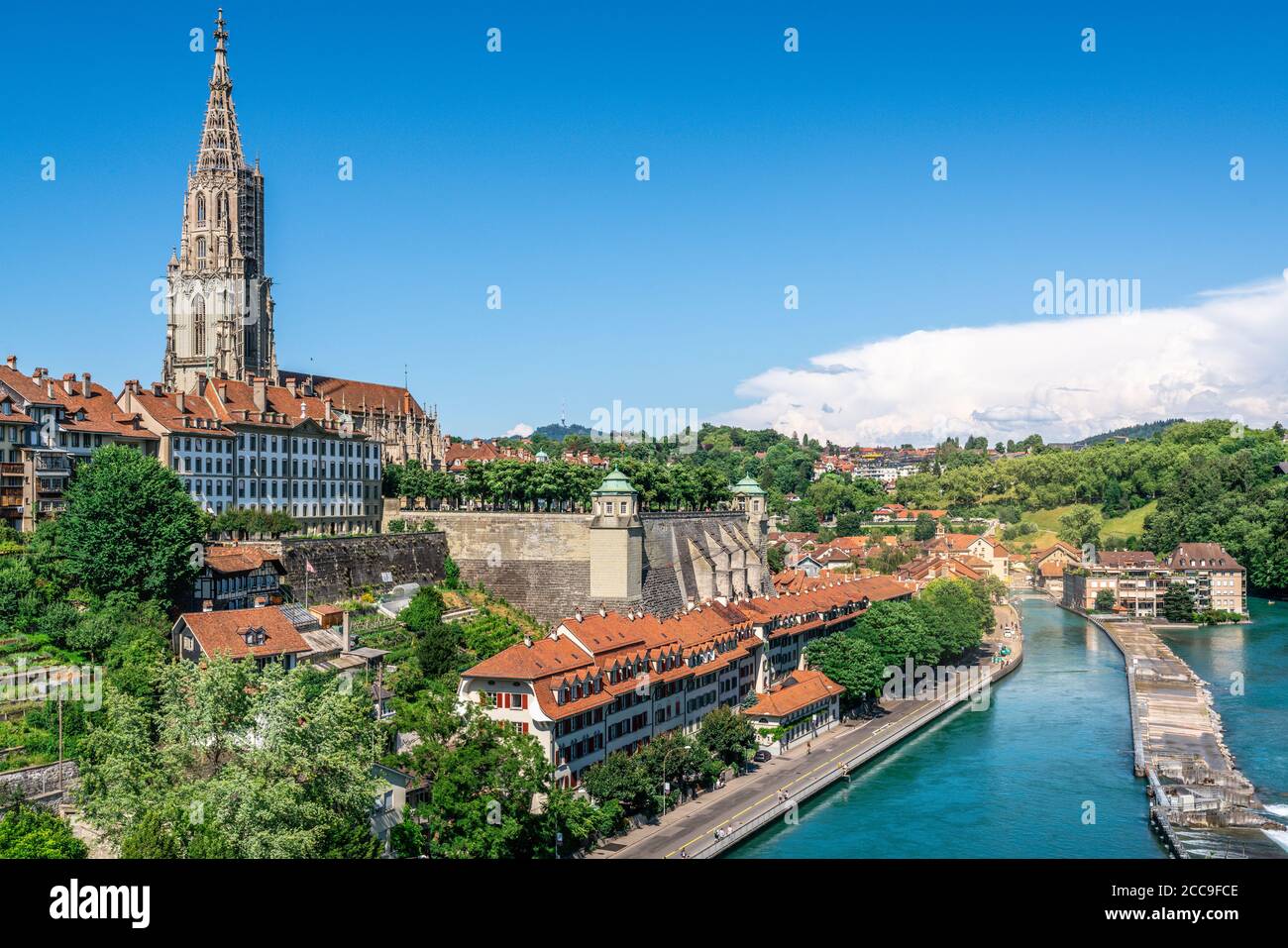 Scenic Bern old town cityscape with old buildings Bern Minster cathedral tower and Aare river view in Bern Switzerland Stock Photo