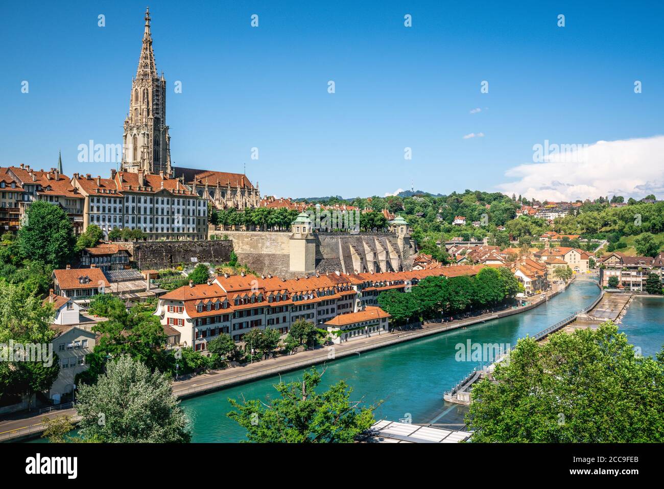 Scenic Bern old town cityscape with old buildings Bern Minster cathedral tower and Aare river view in Bern Switzerland Stock Photo