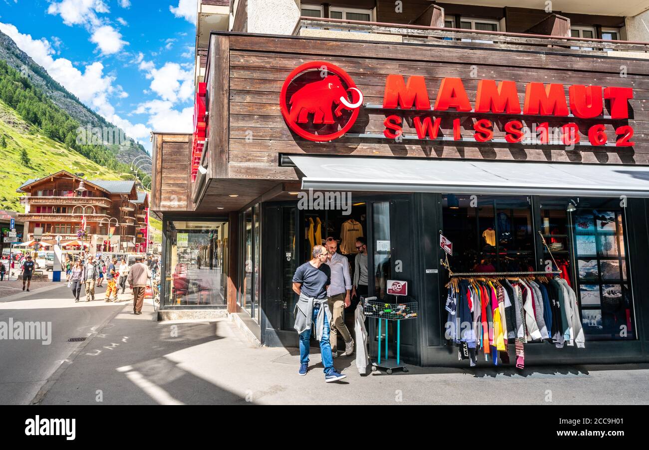 Zermatt Switzerland , 2 July 2020 : People leaving Mammut 1862 store a Swiss mountain sports clothing and equipment shop in Zermatt Switzerland Stock Photo