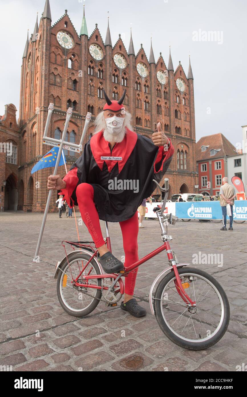 Ribnitz Damgarten, Germany. 20th Aug, 2020. Velo-designer Dieter (Didi)  Senft is standing in front of the town hall in Stralsund. Under the motto  "Your Ride", small groups of sports-loving racing cyclists will