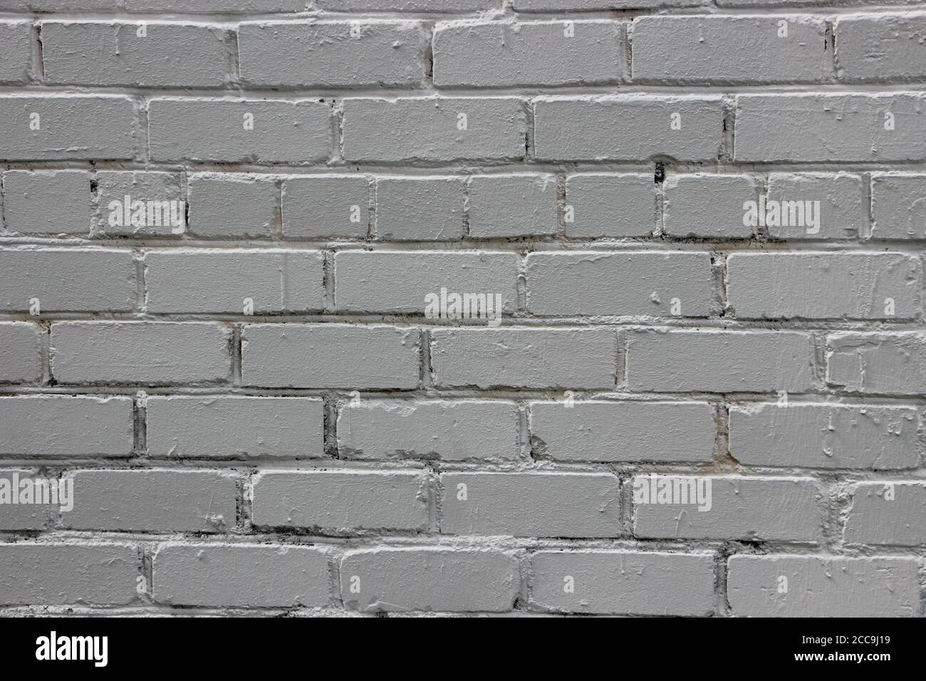 Light grey grunge brick wall background texture Stock Photo - Alamy