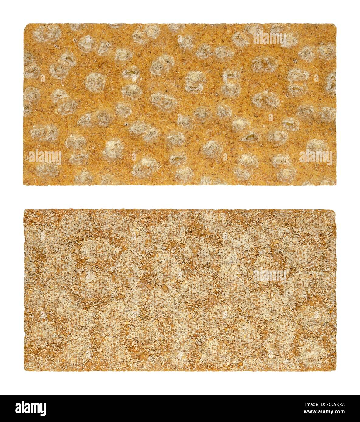 Rye crispbread from the front and back side, close-up from above. Rectangle shaped flat and dry cracker made of rye flour. Light bread. Keeps fresh. Stock Photo