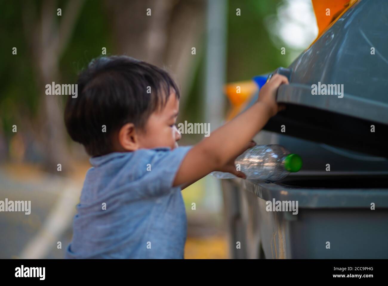 Children Picking Up Trash High Resolution Stock Photography and Images