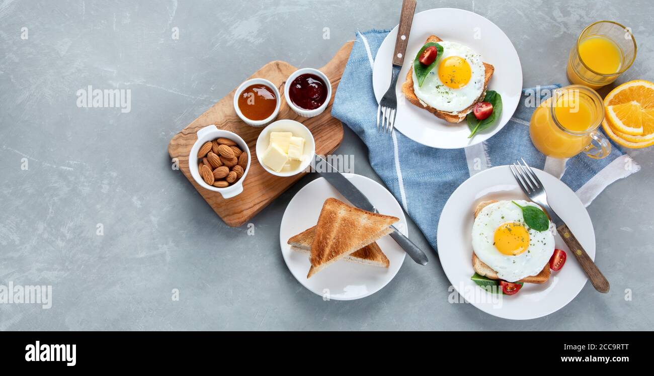 Traditional American breakfast on grey background . Top view, flat lay, copy space. Panorama, banner Stock Photo