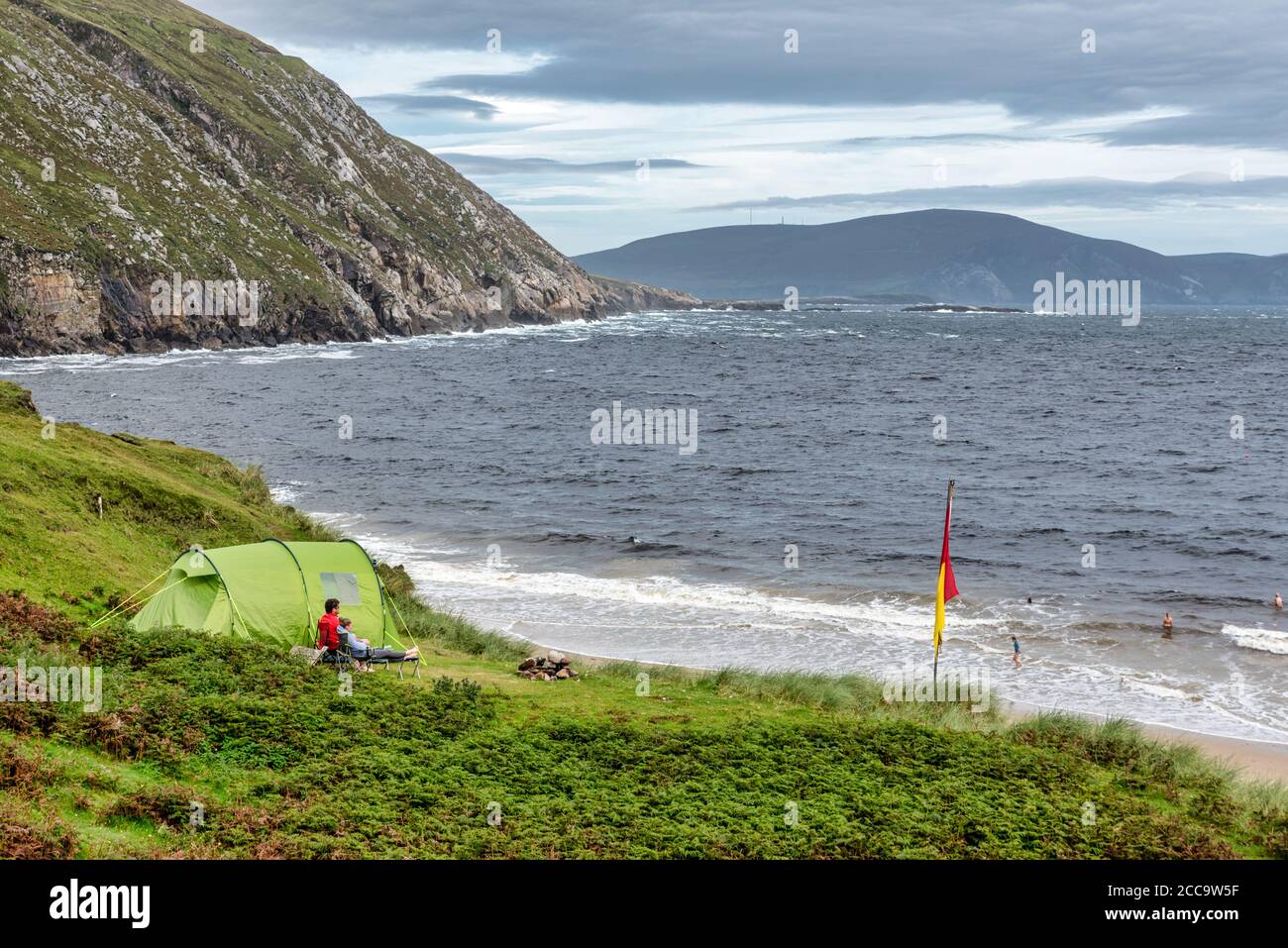 Achill, Ireland- Jul 30, 2020: People wild camping at Keem Bay  on Achill Island County Mayo in Ireland Stock Photo
