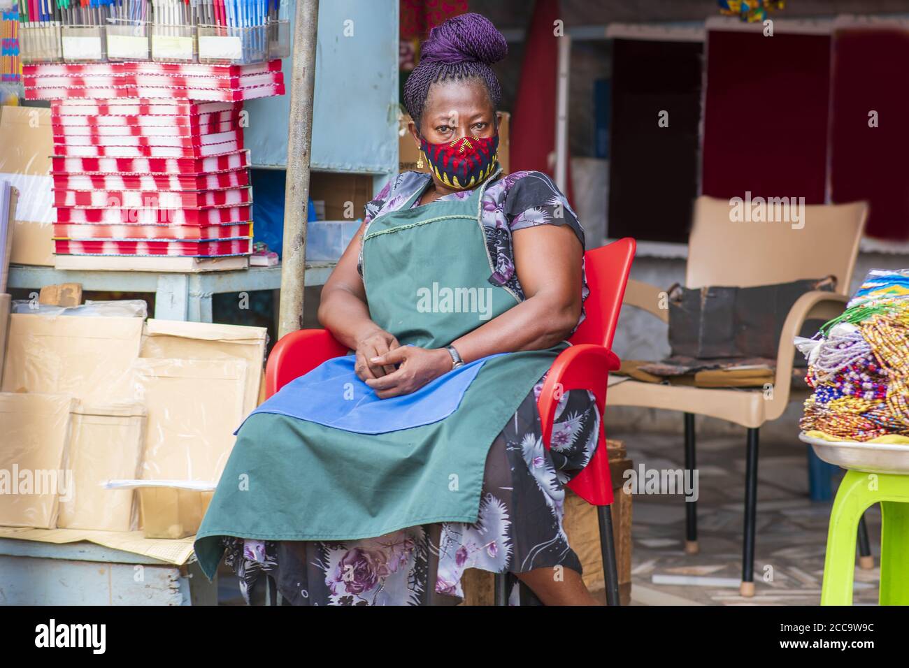 Old woman wearing apron sitting hi-res stock photography and images - Alamy