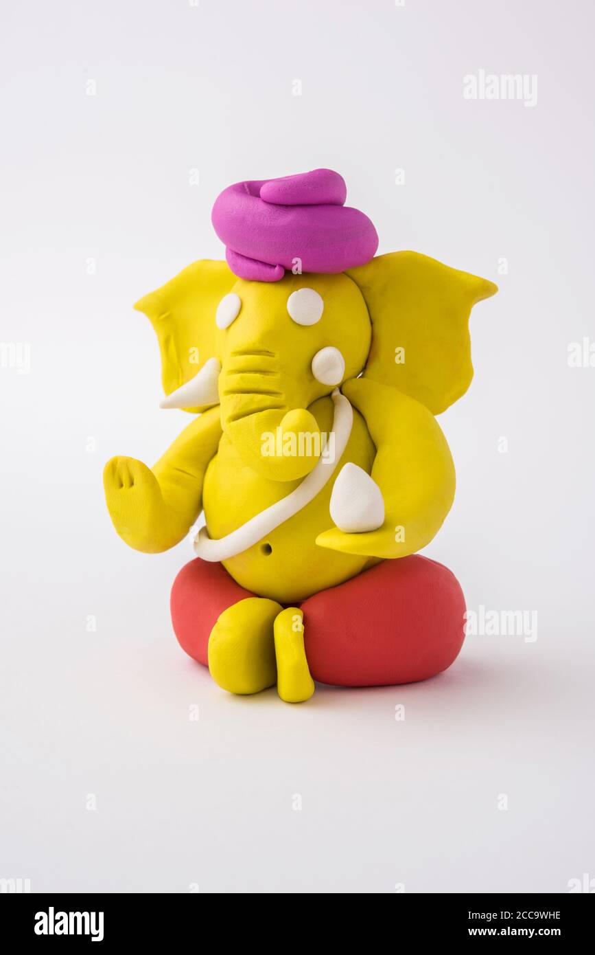 Homemade Lord Ganesha idol for Ganesh Chaturthi Festival using colourful clay or play dough Stock Photo