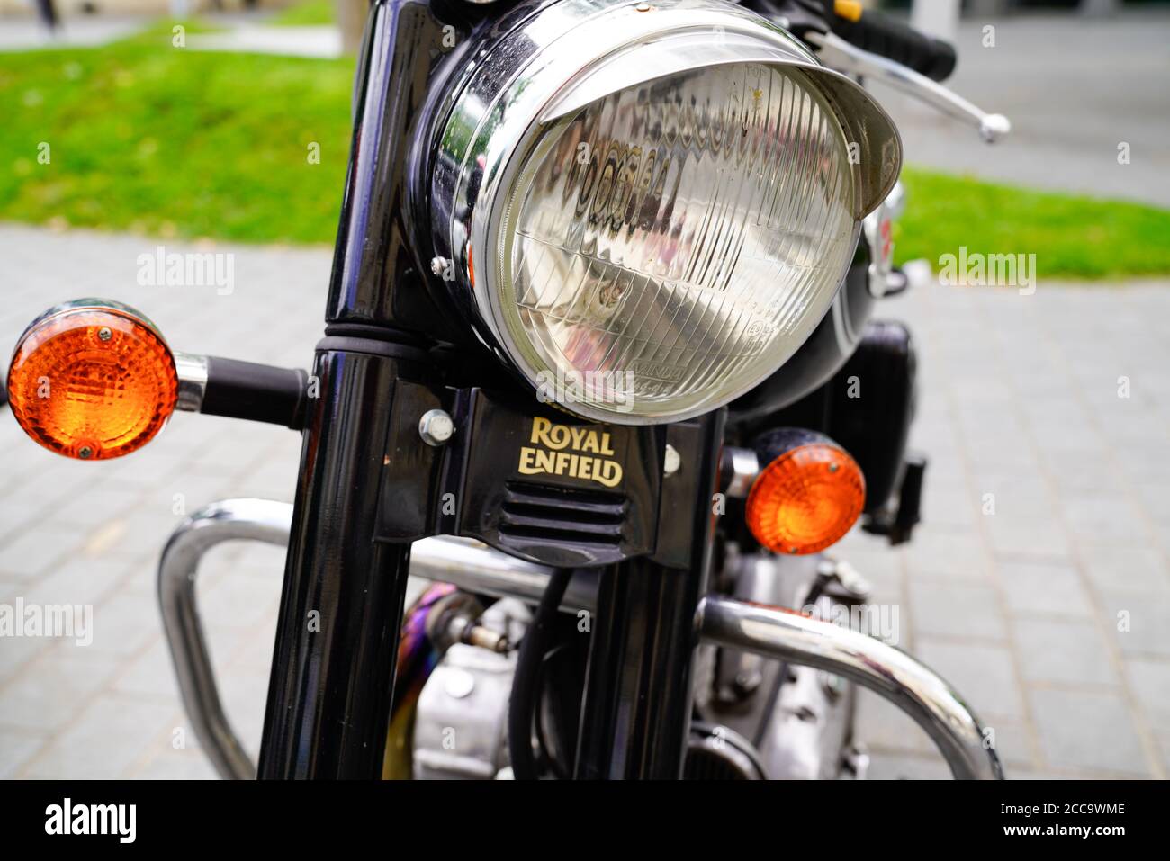 Bordeaux , Aquitaine / France - 08 16 2020 : Royal Enfield logo sign front of motorcycle closeup with headlight on classic indian motorcycle Stock Photo