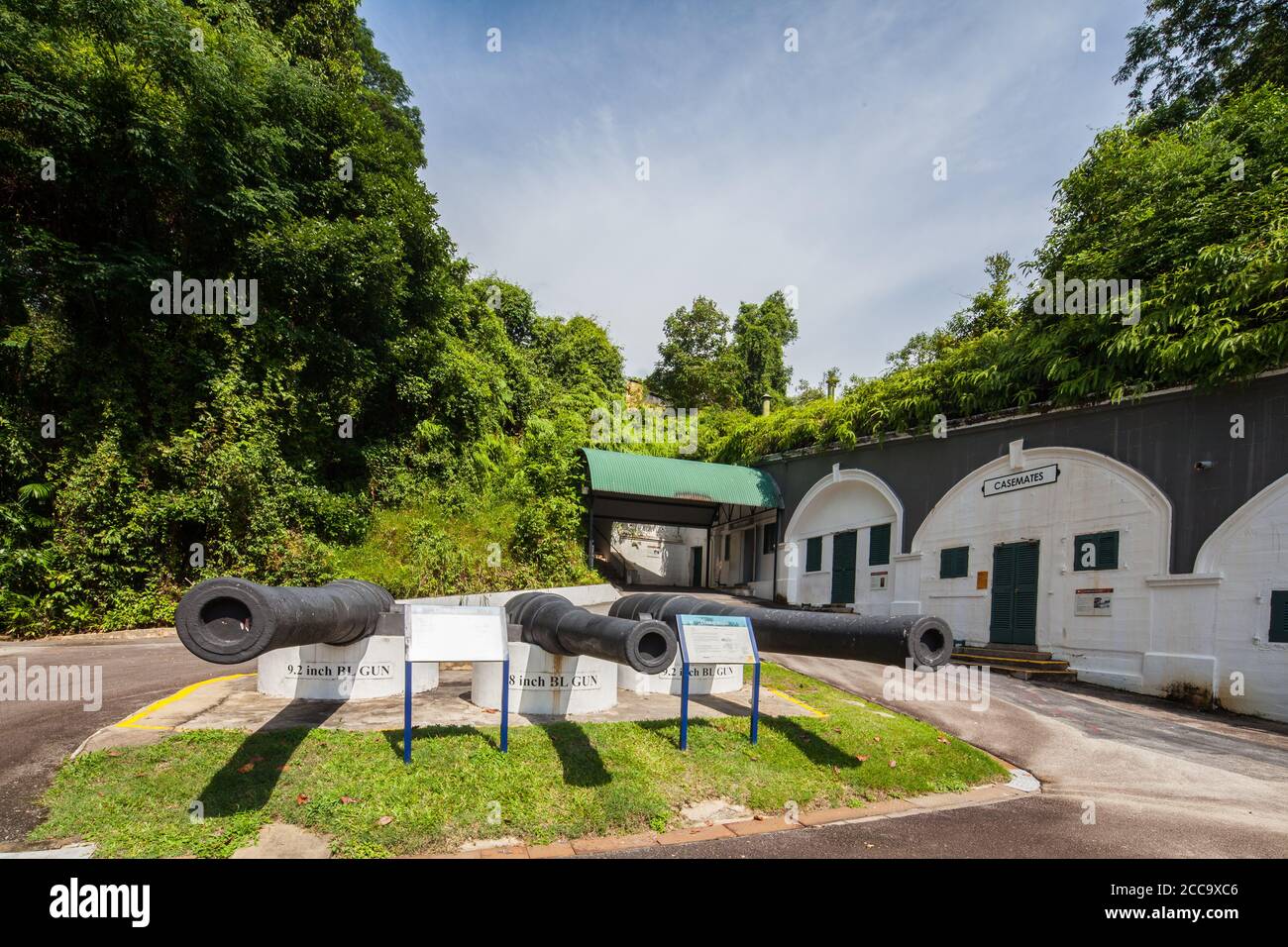 Fort Siloso is a decommissioned coastal artillery battery in Sentosa, image with three old long cannons pointing outward. Singapore Stock Photo