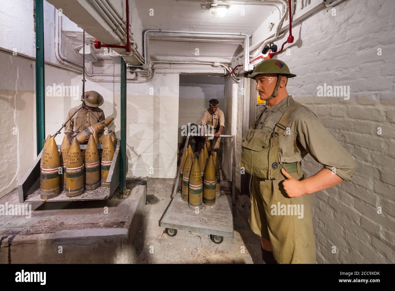 Enact of British soldiers moving and loading ammunition in a bunker. Fort Siloso, Sentosa, Singapore Stock Photo