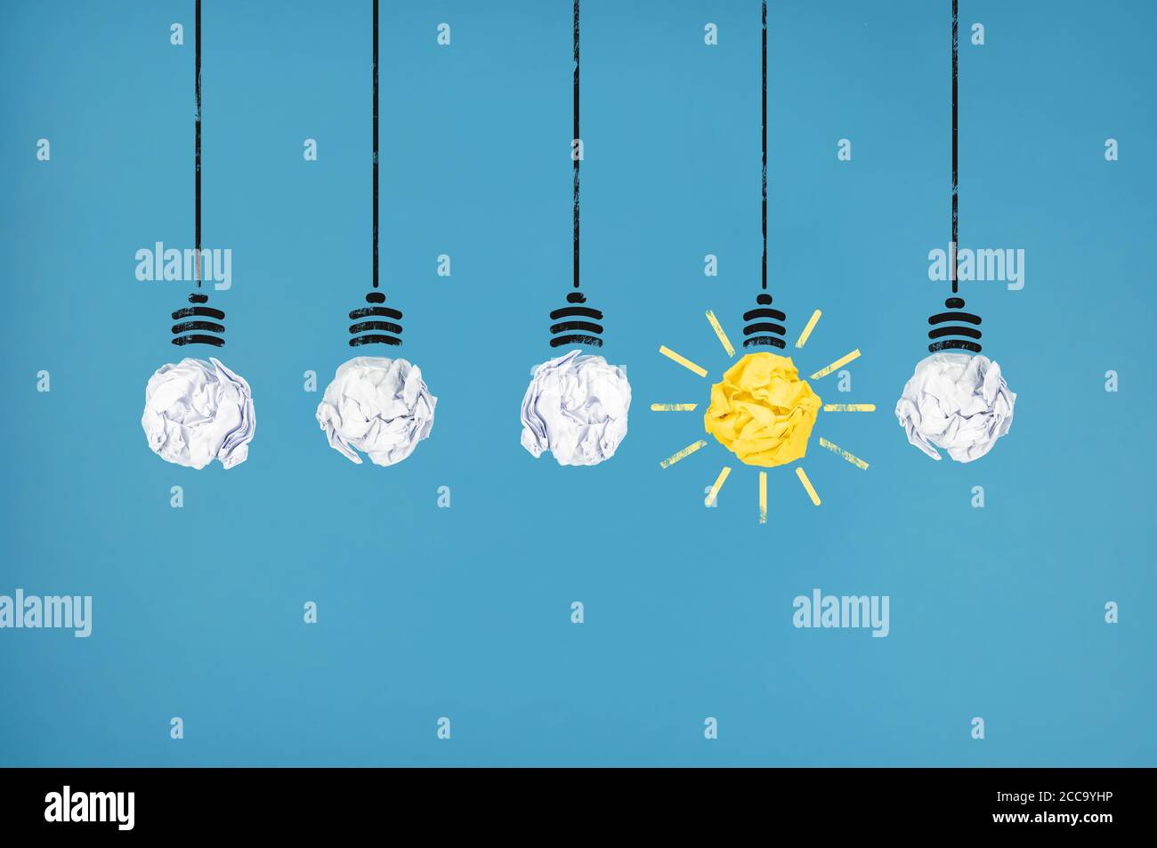 row of paper ball light bulbs with one being illuminated, brainstorming and having an idea concept Stock Photo