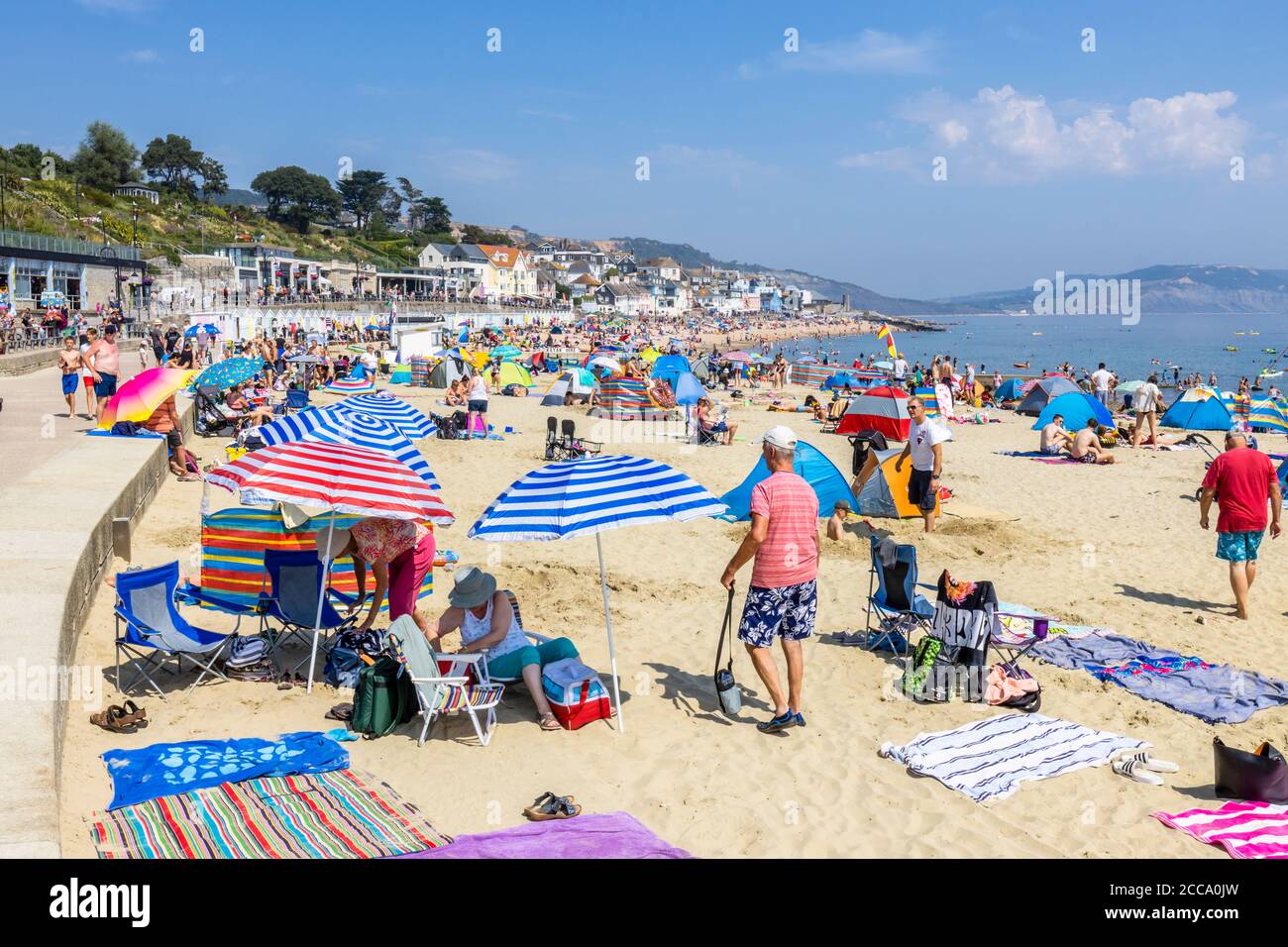 Family sunbathing beach lyme regis hi-res stock photography and images ...