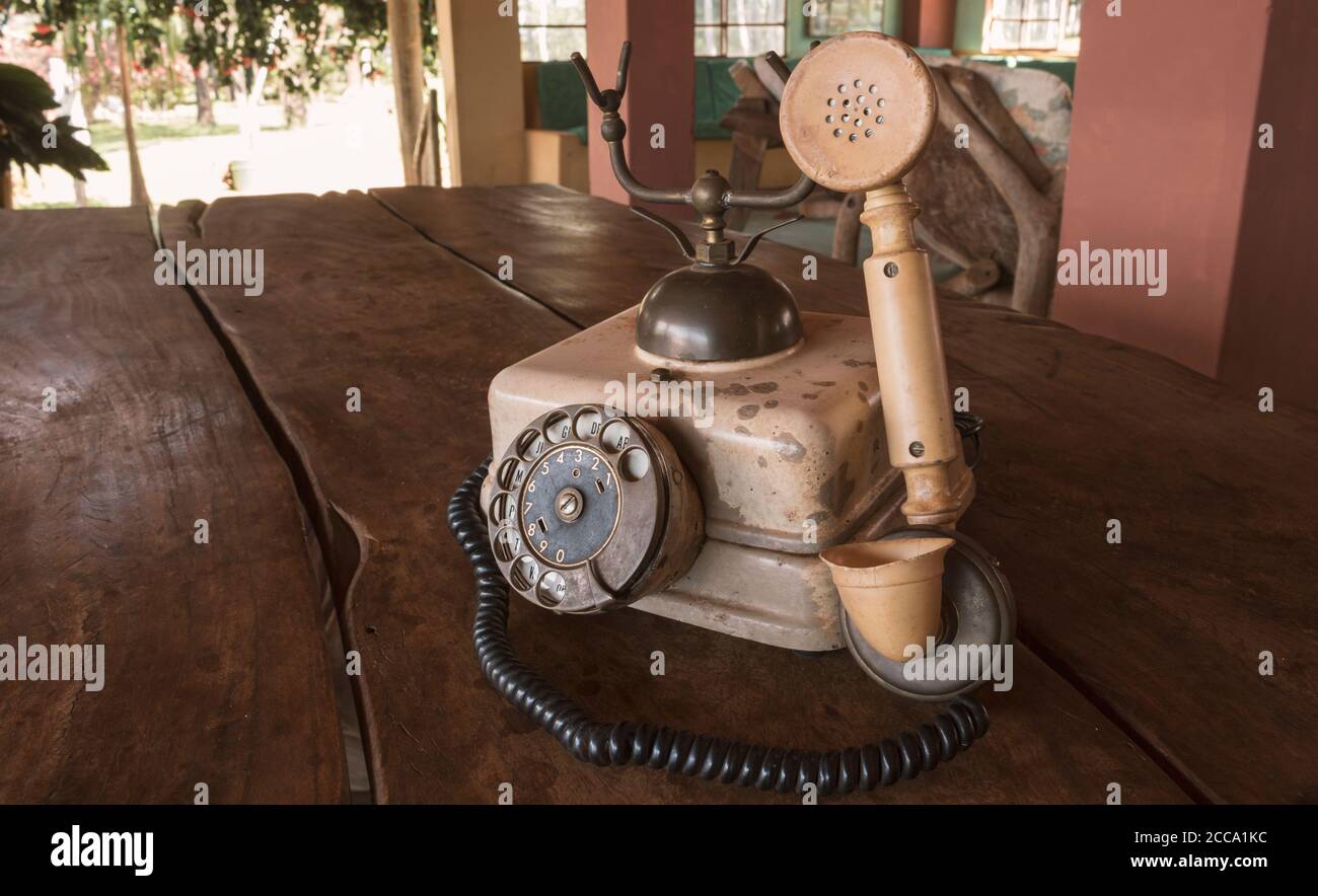 Old Beige phone retro on a wood table Stock Photo