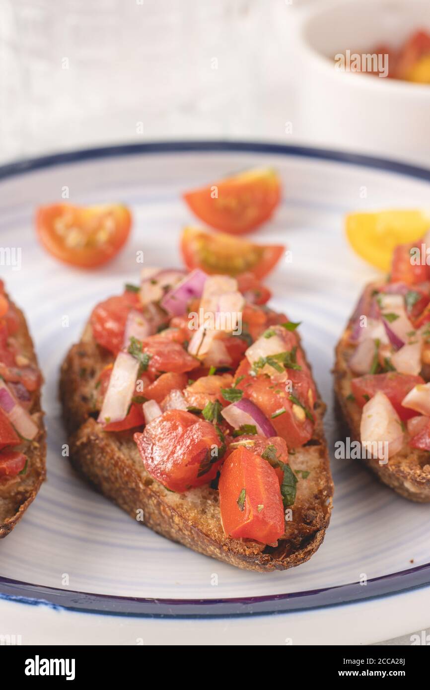 Mediterranean bruschetta with tomato, olive oil, parsley and red onion
