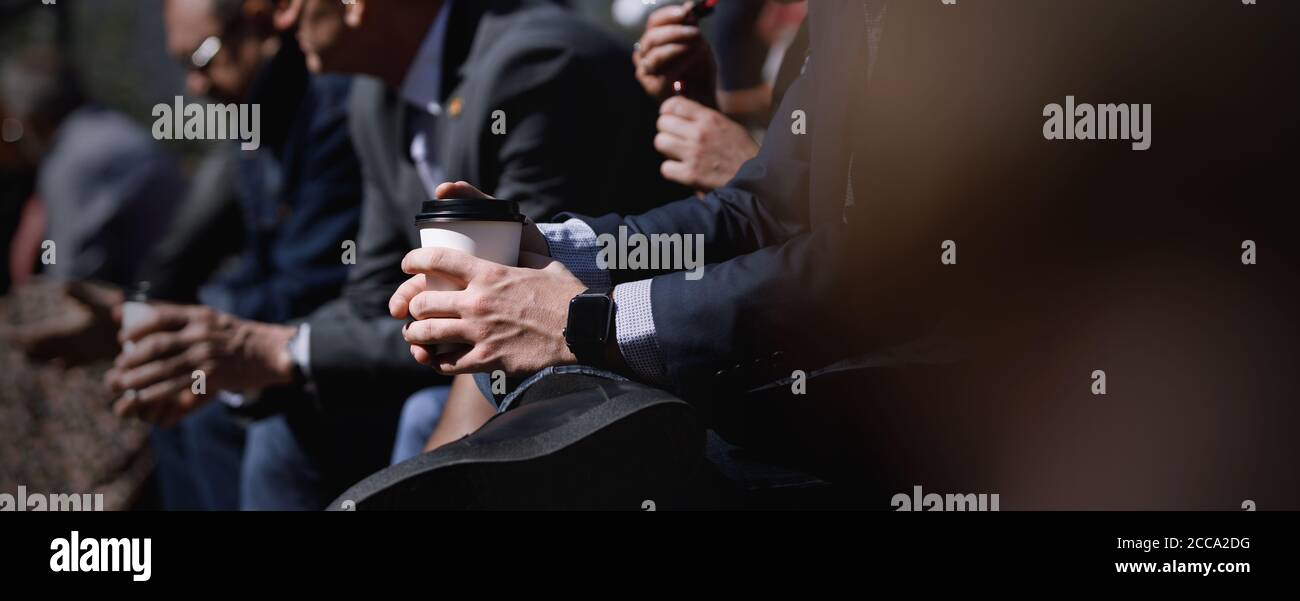 Banner template of business audiences sitting with coffee during break in conference hall, event and seminar concept Stock Photo